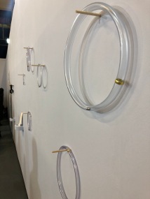 The rings suspended on the wall.